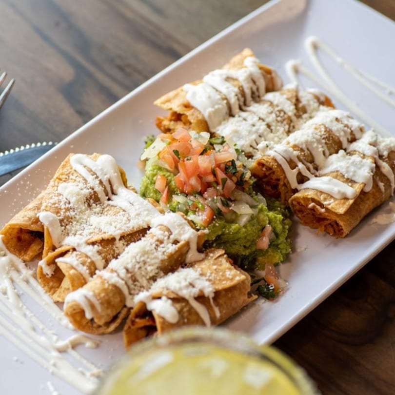 Alejandra's Mexican Restaurant's taquitos with guacamole, pico de gallo, sour cream, and cotija cheese.